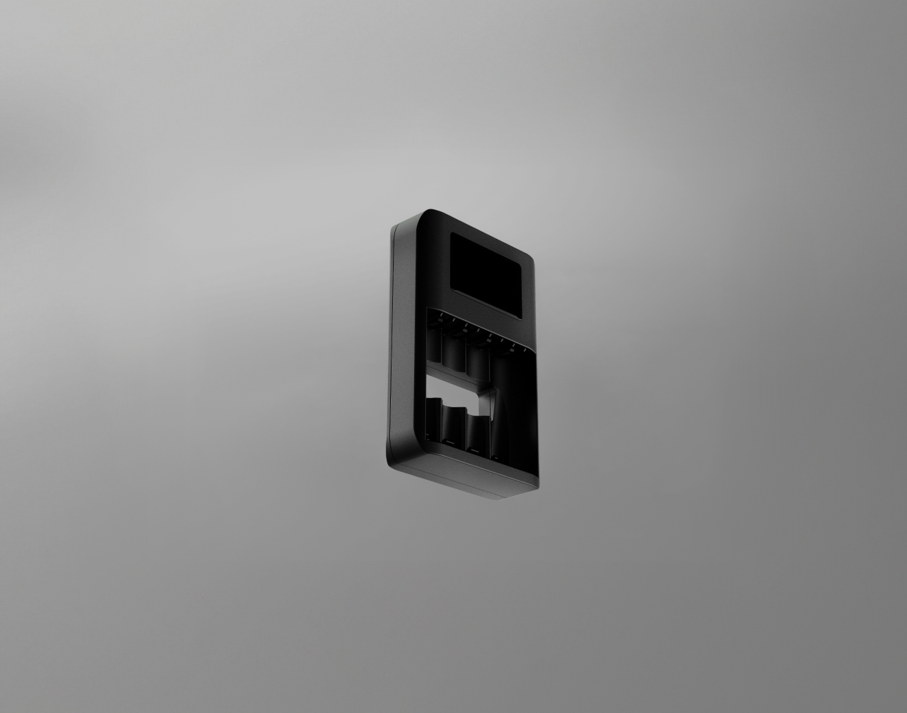 A black charger for rechargeable batteries, displayed against a neutral gray background.